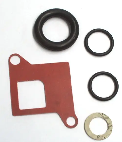 Dichtungen und O-Ringe von Daikin in verschiedenen Größen, passend für hydraulische Anwendungen. Enthält eine rote Dichtung und mehrere O-Ringe aus Gummi und Metall.